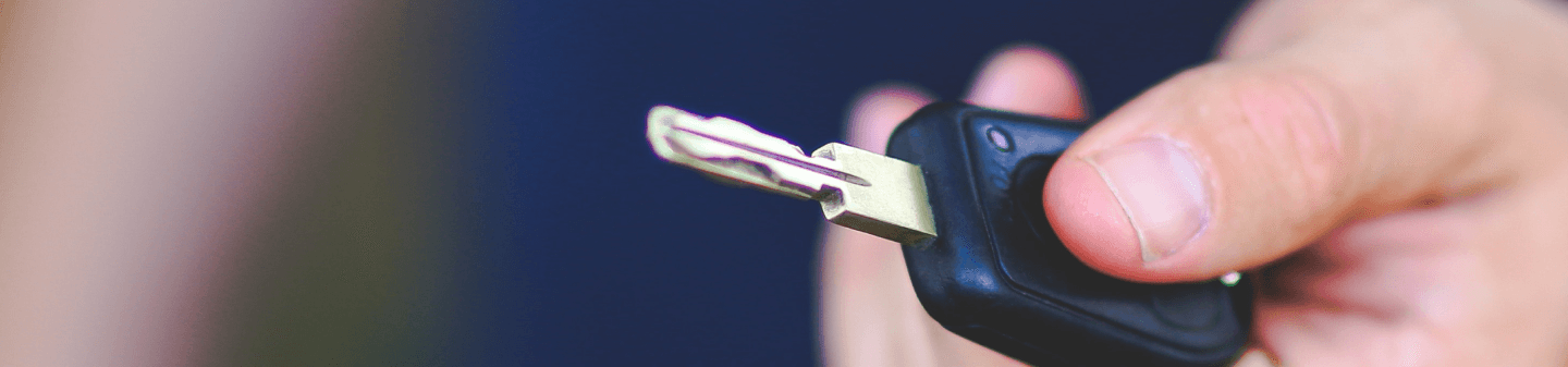 holding a car key